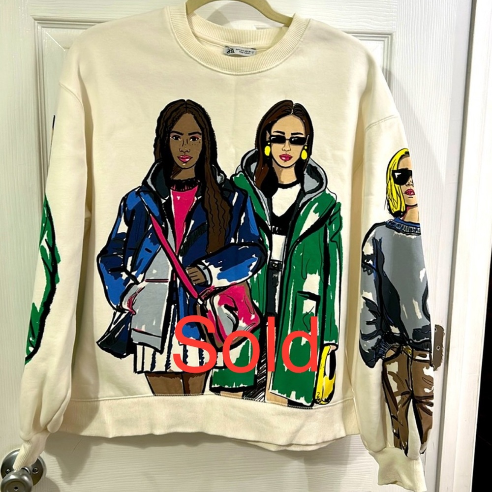 Zara pullover with trendy design.